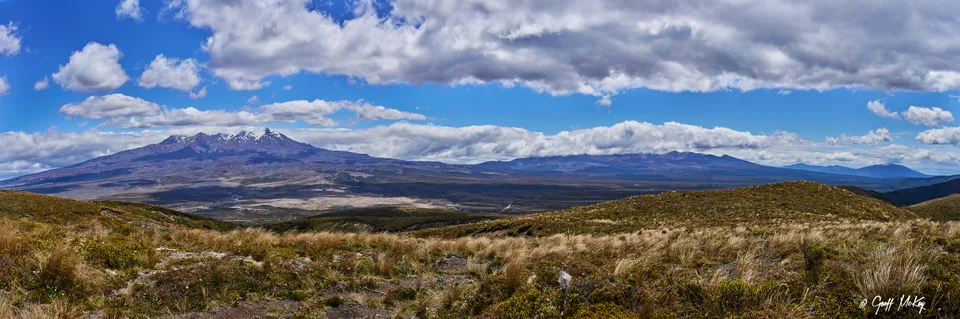 Tussock country and Mount Ruapehu beneath broken cloud on New Zealand’s Central Plateau.